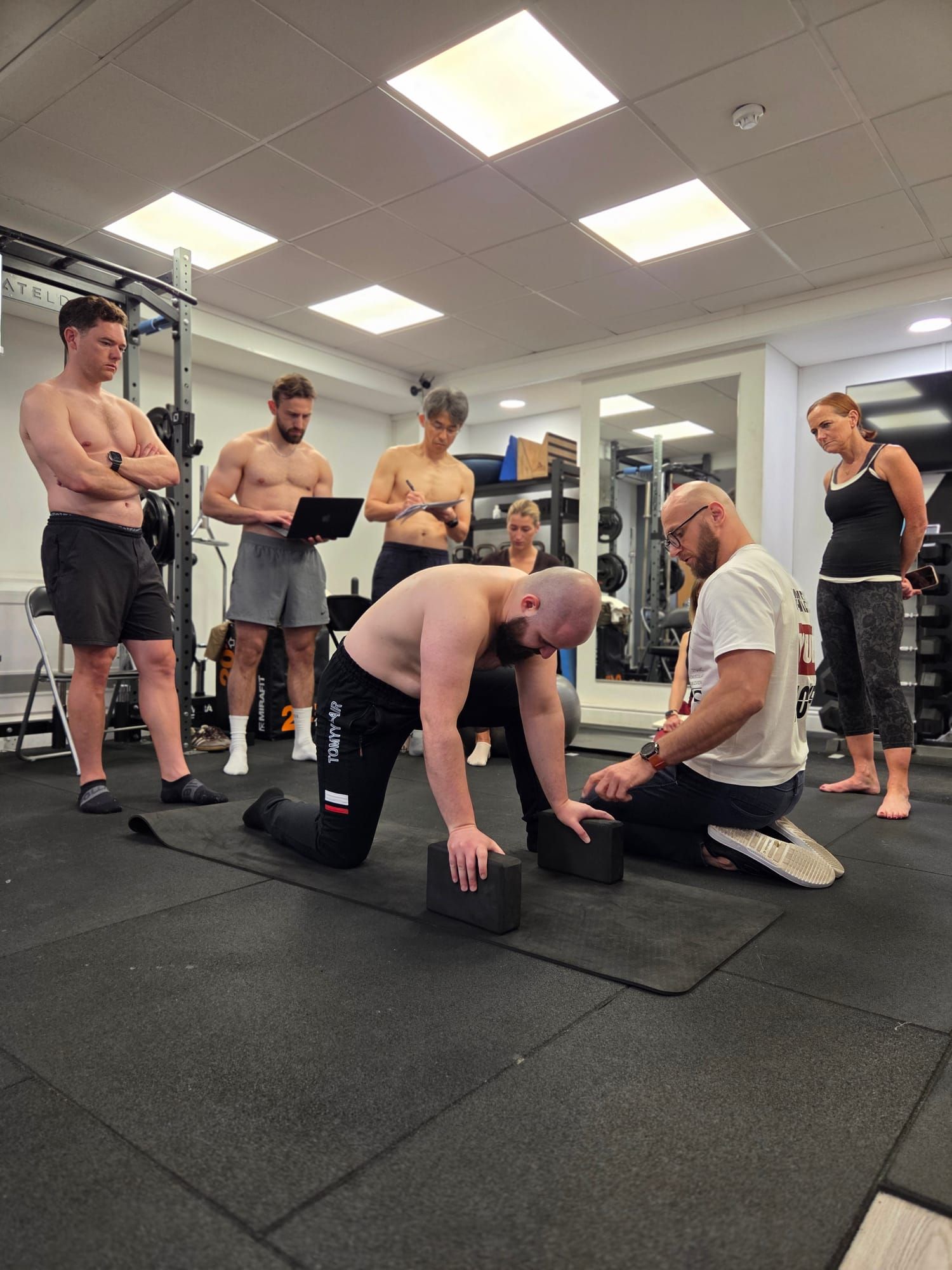 DNS Exercise Part II group practising resistance-based work with instructor Łukasz Burliński at Elevate LDN